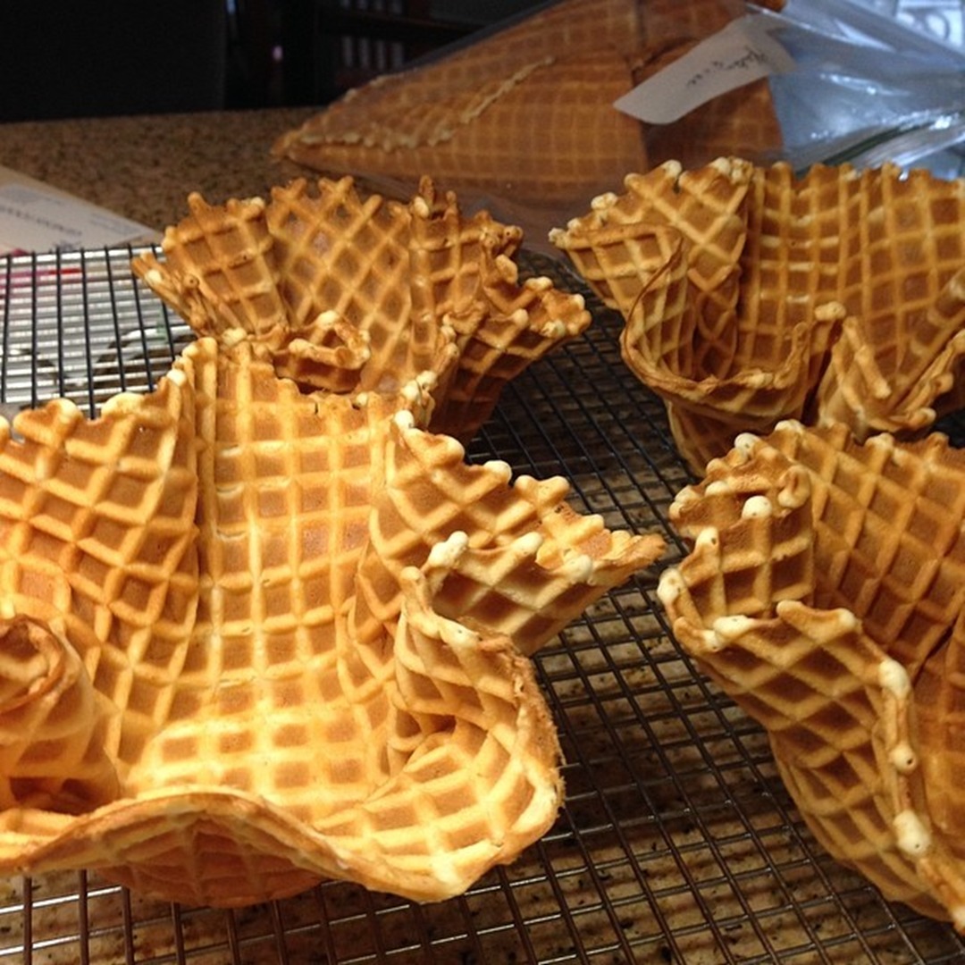 Freshly baked waffles on a cooling rack